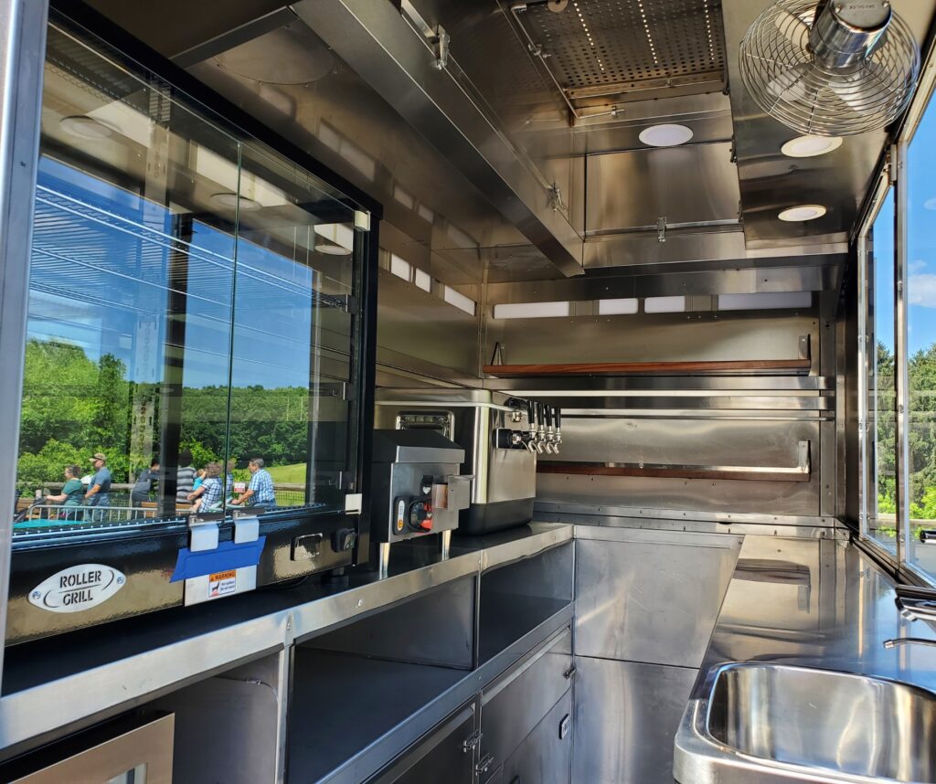 Back-lit billboard signage integrated into a custom mobile trailer